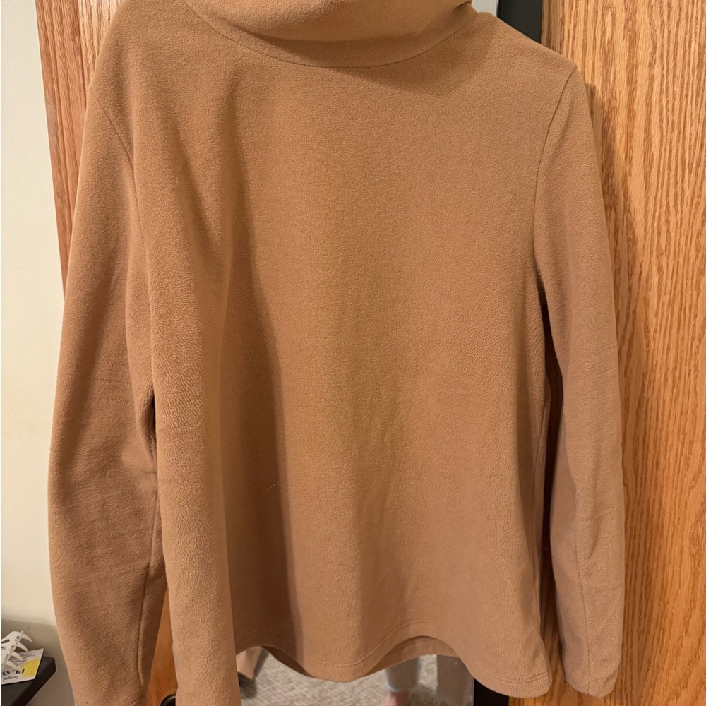 Dudley Stephen’s camel Greenpoint turtleneck.